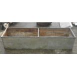 A galvanized metal water trough. Is watertight with bracer bar in centre, H40cm x L190cm x W40cm.