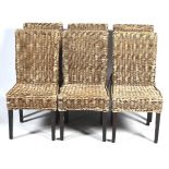 A set of six rattan dining chairs.