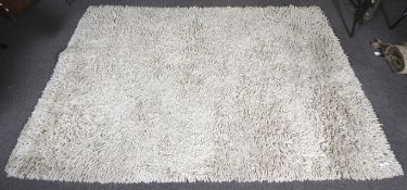 A large coarse woven wool rug.