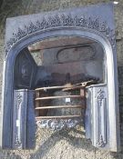 A Georgian cast metal fireplace.