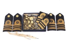 A collection of assorted Gieves military buttons, naval epaulettes and a whistle.