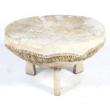 A cow hide drum coffee table.
