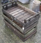 Four vintage wooden apple crates.