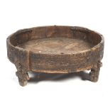 A low tribal hardwood table.