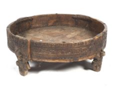 A low tribal hardwood table.