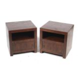 A pair of hardwood bedside cabinets.