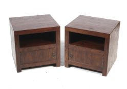 A pair of hardwood bedside cabinets.