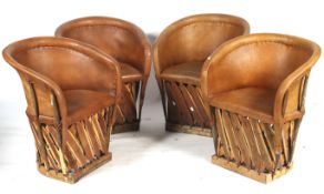A set of four leather and wood tub chairs.