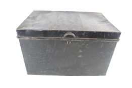 A vintage black metal deed box.