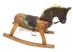 A vintage handmade wooden rocking horse.