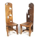 A pair of solid rustic hardwood high back chairs.