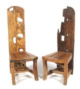 A pair of solid rustic hardwood high back chairs.