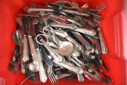 A quantity of assorted silver plate cutlery. Including forks, knives, serving spoons, etc.