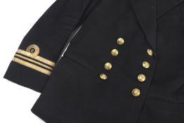 A vintage Baker & Co Naval Officers dress uniform and two white 'Tropical' dress jackets.