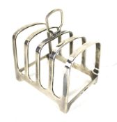 A silver oblong four division toast rack.