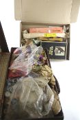 An assortment of sewing items contained within a vintage leather case.