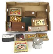 An assortment of vintage games. Including a chess set, draughts set, board games, counters, etc.