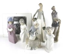 A collection of Lladro and similar style figures.