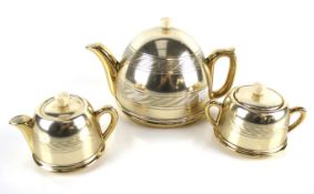 A vintage Beverley 'Pot of Gold' teapot, milk jug and sugar bowl.