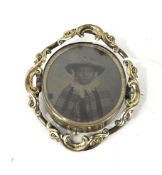 An early-mid Victorian gold-plated swivelling 'photographic' brooch.