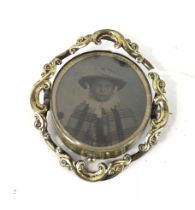 An early-mid Victorian gold-plated swivelling 'photographic' brooch.