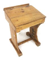 A vintage pine school desk.