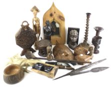 A collection of carved tribal and cultural items. Including boxes, figures, a framed mirror, etc.