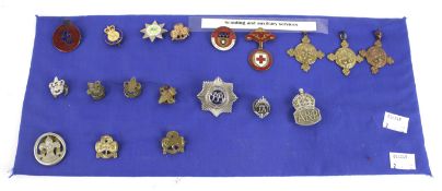A collection of Scouting and auxiliary services brooches.