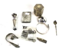 A collection of silver to include a loaded short round candlestick, damaged,