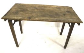 A vintage wooden folding tressel work table.
