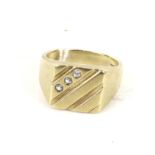 A modern 9ct gold and cubic zirconia three-stone square signet ring.
