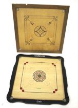 Two wooden Carrom (a traditional Indian board game).