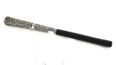 An Indian white metal mounted cane handle.