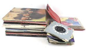 A collection of vintage vinyl records. Including The Beatles, Cliff Richard, The Zombies, etc.