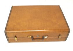 A vintage Samsonite tan leather suitcase. No.