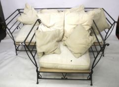 A contemporary two piece sofa suite. With cream cushions and a metal frame.