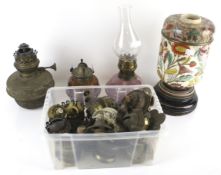 An assortment of 19th century and later oil lamp components.
