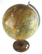 A vintage German 1949 terrestrial globe. 'Räths Physikalischer Globus Erdglobus' on a wooden base.