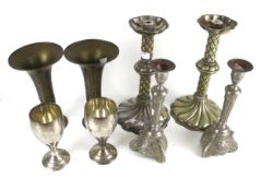 Two pairs of metal candlesticks and two pairs of goblets. Max.