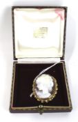A vintage 9ct gold mounted oval shell cameo brooch.