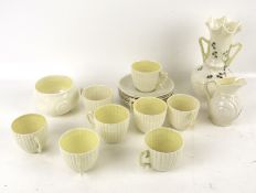 An early Belleek Irish porcelain eight piece shell tea service and a vase.