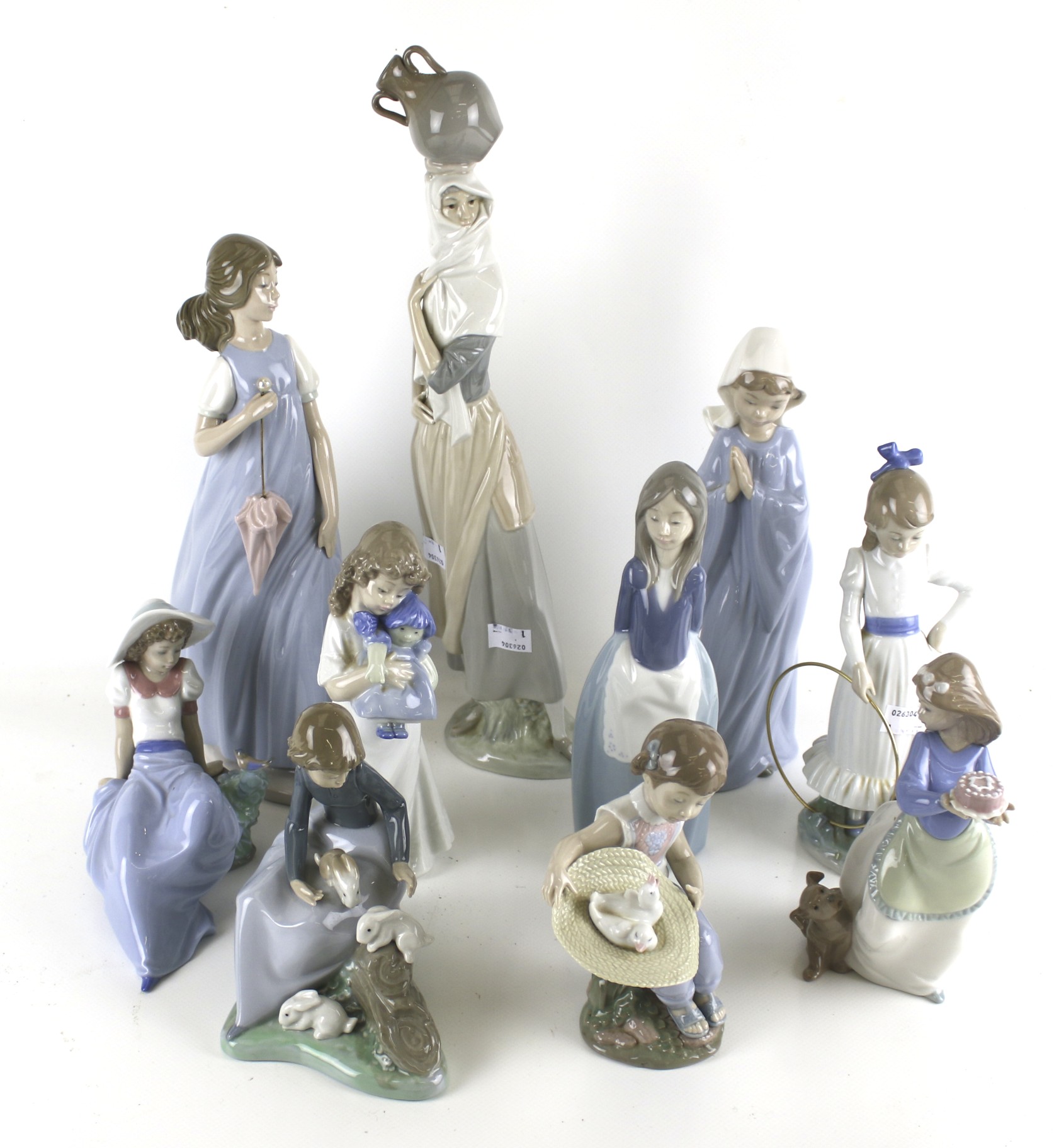 A collection of ten assorted Spanish Lladro and Nao figures of girls. Max.