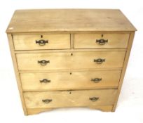 A stripped oak chest of drawers.
