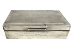 A silver rectangular cigarette box.