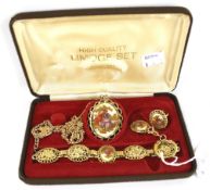 A set of gold-plated 'Limoges' jewellery.