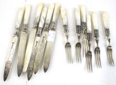 A set of six Edwardian silver and mother of pearl handled fruit knives and forks.