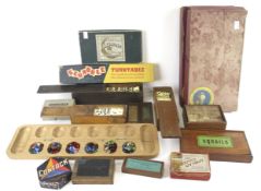 An assortment of vintage board games and accessories.