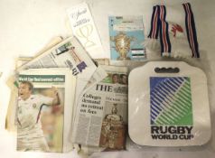 An assortment of Rugby World Cup ephemera. Including an England scarf, 2003 newspaper cuttings, etc.