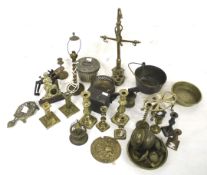 An assortment of brassware. Including candlesticks, a trivet stand, oil cans, etc.