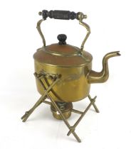A brass kettle and stand.